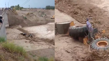 dramatico rescate en mendoza: la crecida arrastro una maquina con dos operarios
