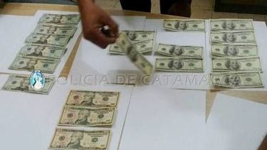 Intentaba vender dólares falsos